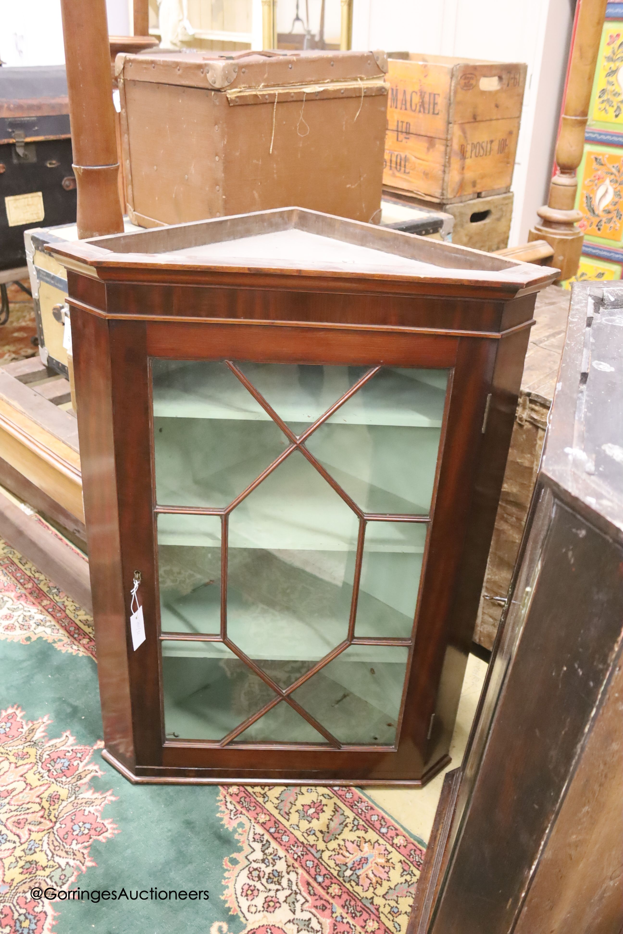 A George III mahogany astragal glazed hanging corner cabinet, width 73cm, depth 44cm, height 101cm